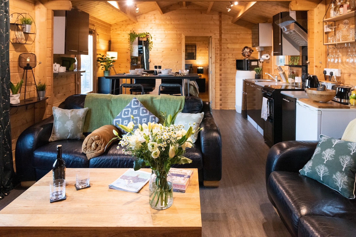 Open-plan lounge and kitchen inside Keepers Cabin