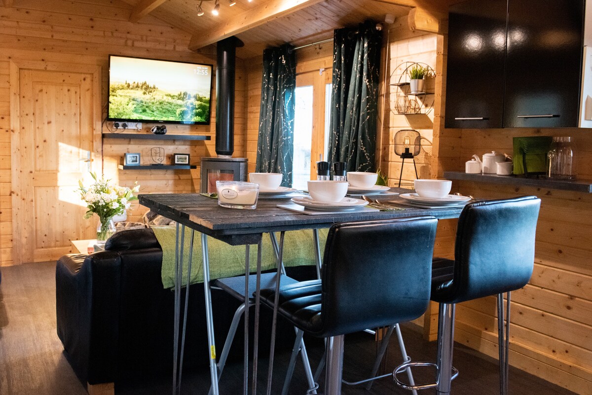 Dining table and breakfast bar in the woodland cabin